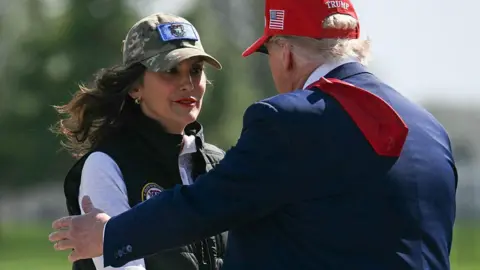 Michigan Gov. Gretchen Whitmer greets President Donald Trump at Selfridge Air National Guard Base