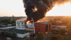 Smoke billows from the derelict Henley College building in Coventry