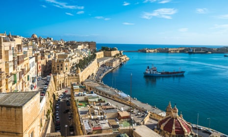 A picturesque view of Malta’s coastline with historic architecture and clear Mediterranean waters.