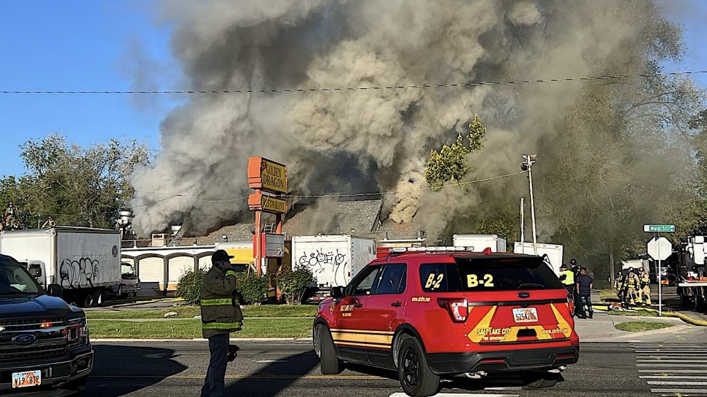 Salt Lake fire aftermath outside burning building with smoke