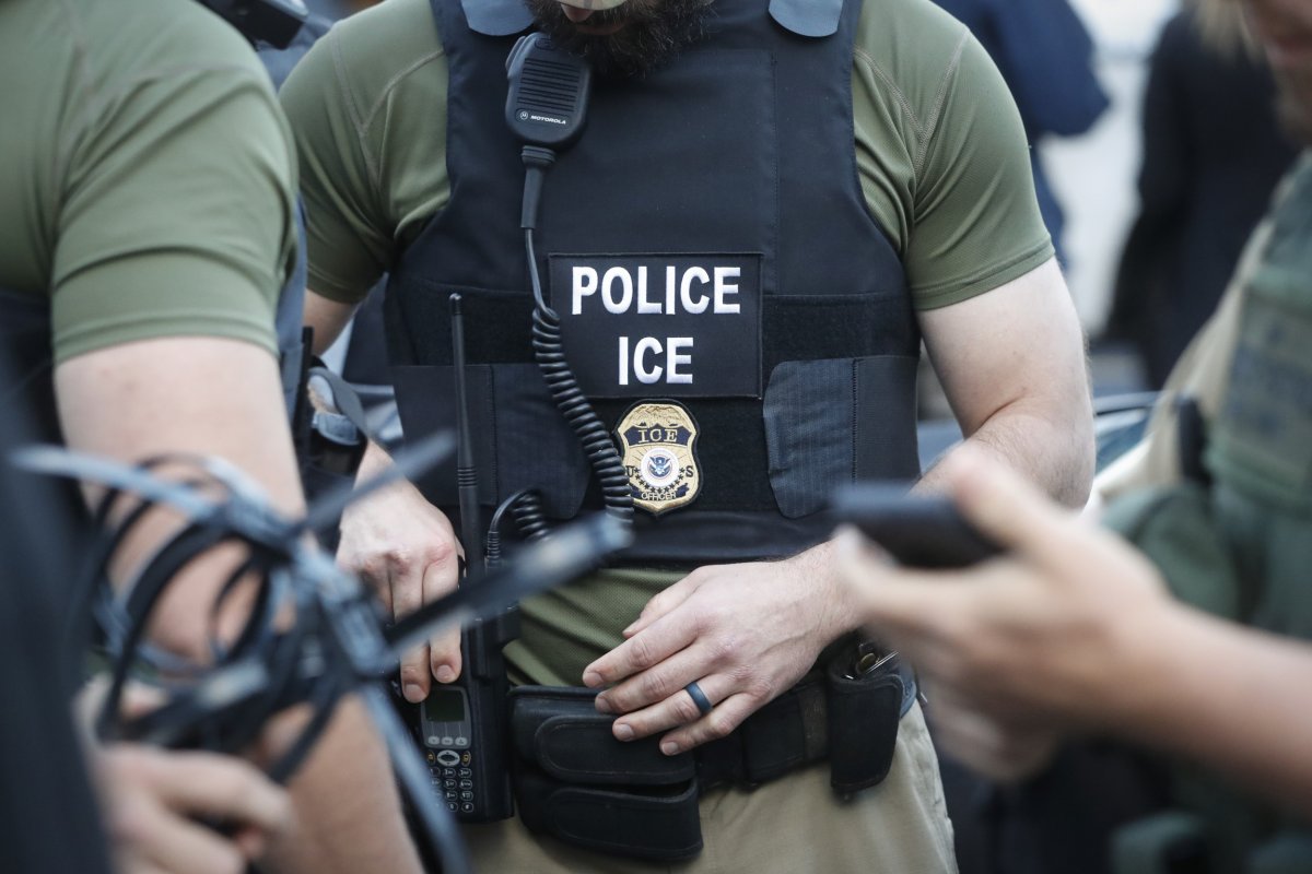 ICE agents outside a residential home during the Oklahoma City ICE raids