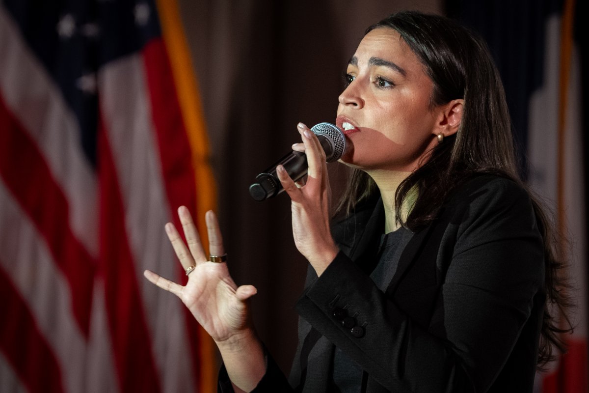 AOC speaks at a town hall on immigration in Queens, NY
