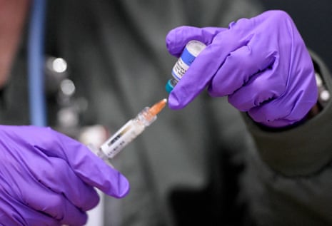Health worker prepares measles vaccine during the current outbreak in a clinic.