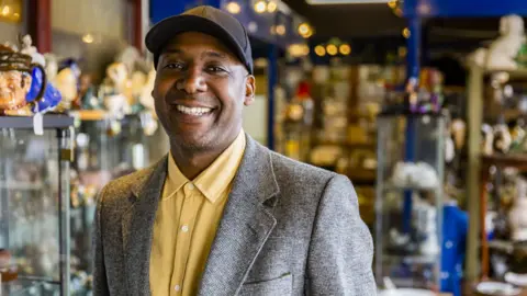 Bargain Hunt expert Ochuko Ojiri appears on BBC News coverage
