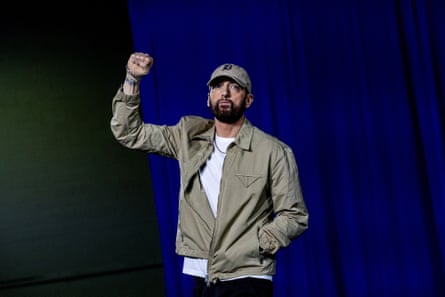 Eminem standing on stage during a Detroit concert.