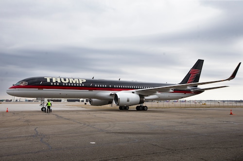 A luxury jet at an airport, symbolizing Qatar's diplomatic influence