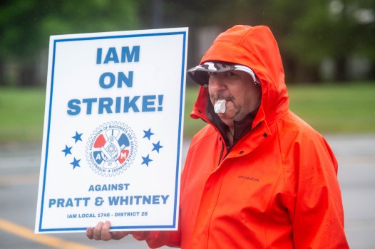 Union members protest for job security and health insurance benefits