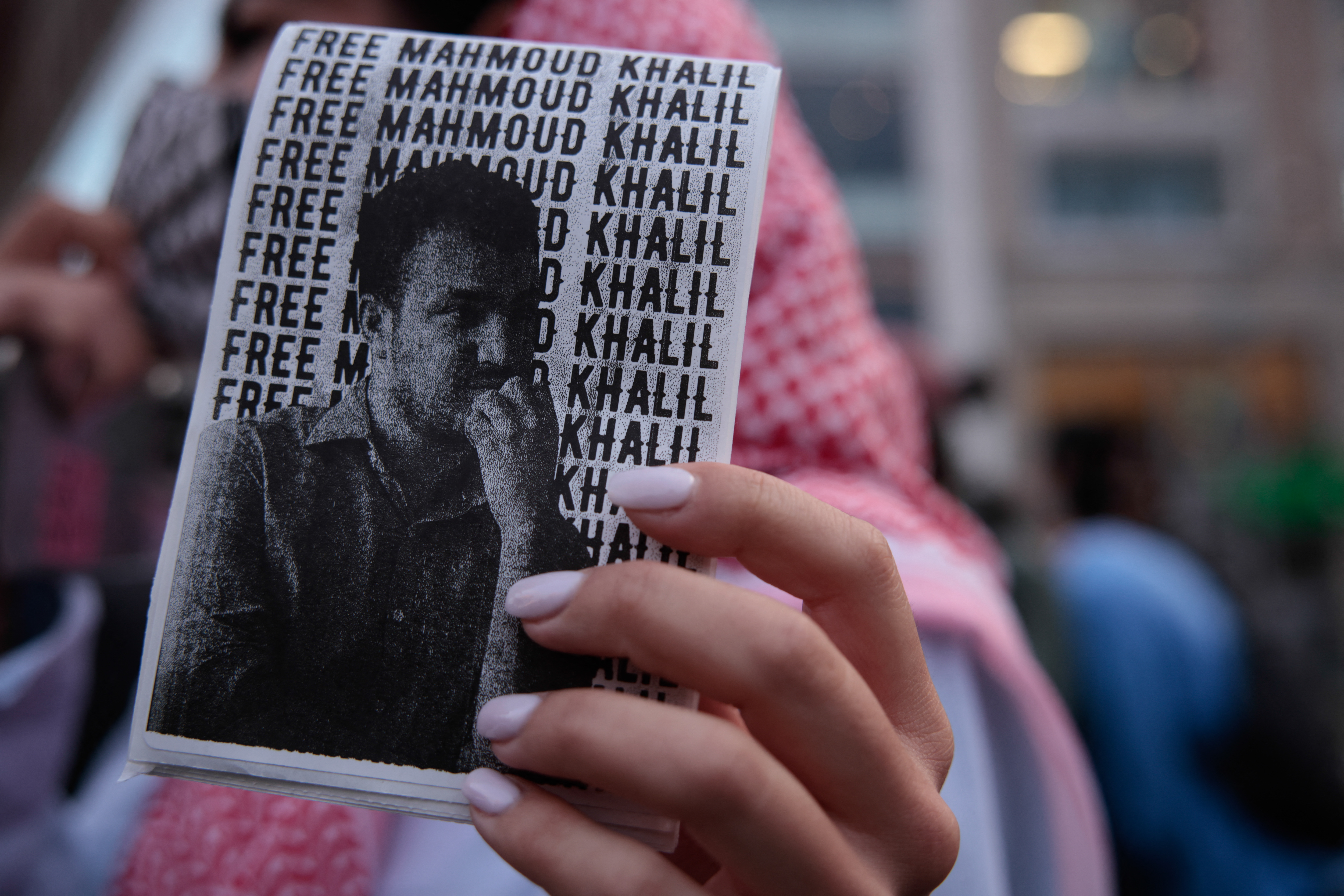 Protesters support Mahmoud Khalil in New York City, holding banners demanding his release